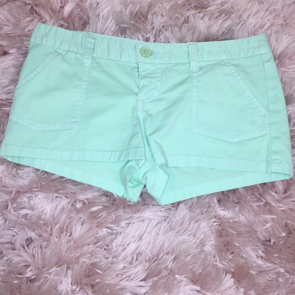 Mint green shorts.